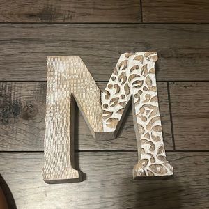 Freestanding letter M